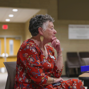 Older woman gazing with interest for the event